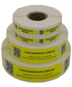 Three stacked rolls of bright yellow Hazardous Drug Label stickers | Maxpert Medical