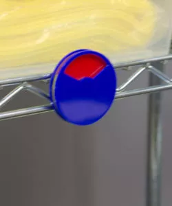 Blue plastic indicator dial with indicator on red attached to metal supply shelf | Maxpert Medical